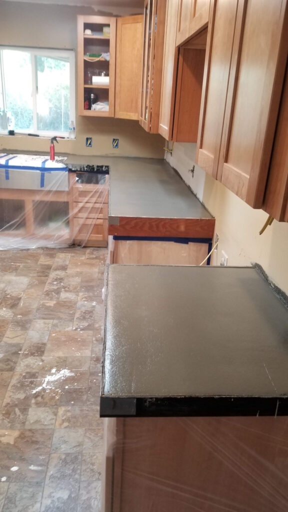 Douglas Biltzen's DB Builders installing custom concrete countertops in a Humboldt County, CA kitchen