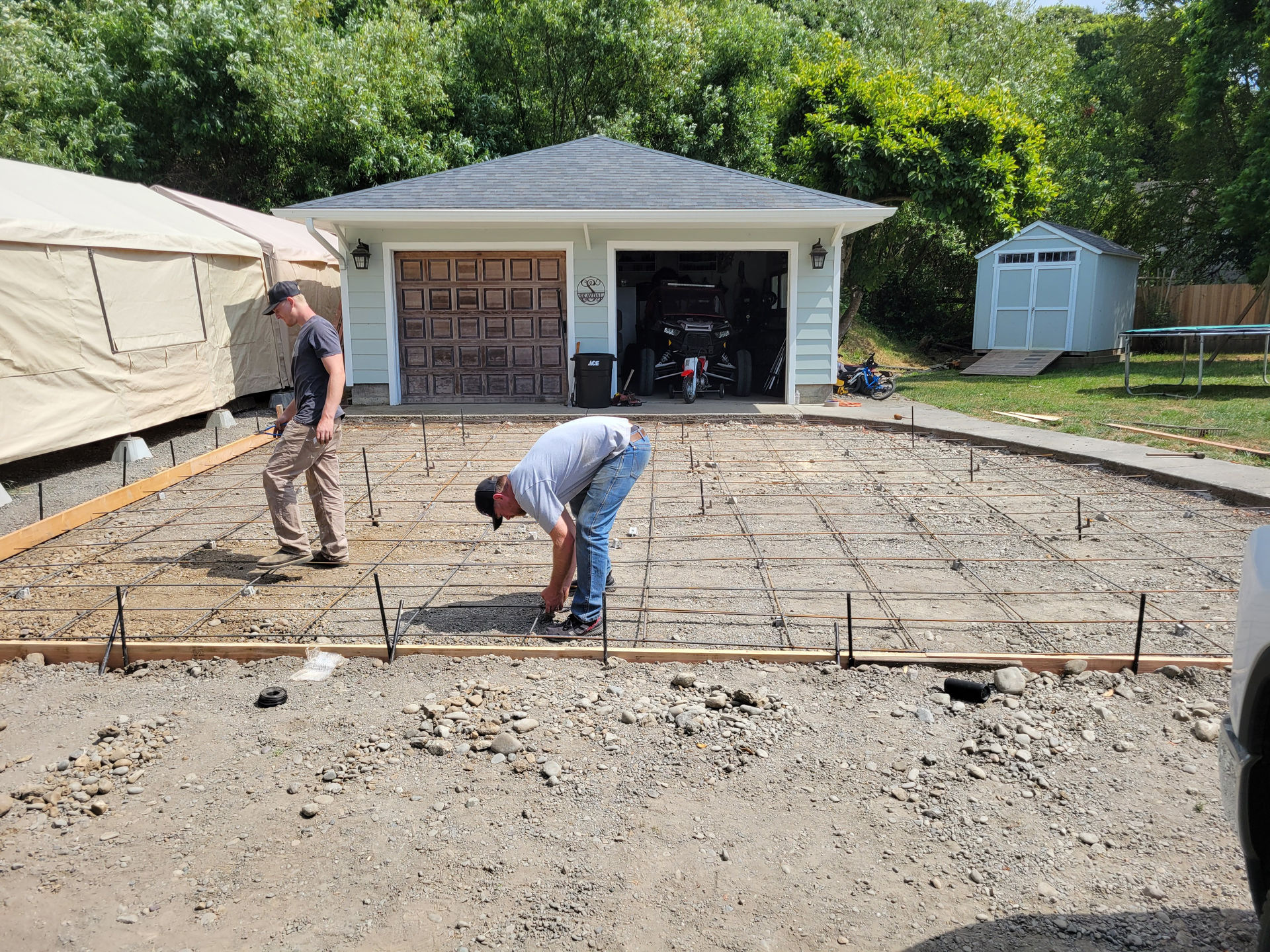 Douglas Biltzen's BP Builders team preparing concrete slab with rebar for a driveway in Humboldt County, CA