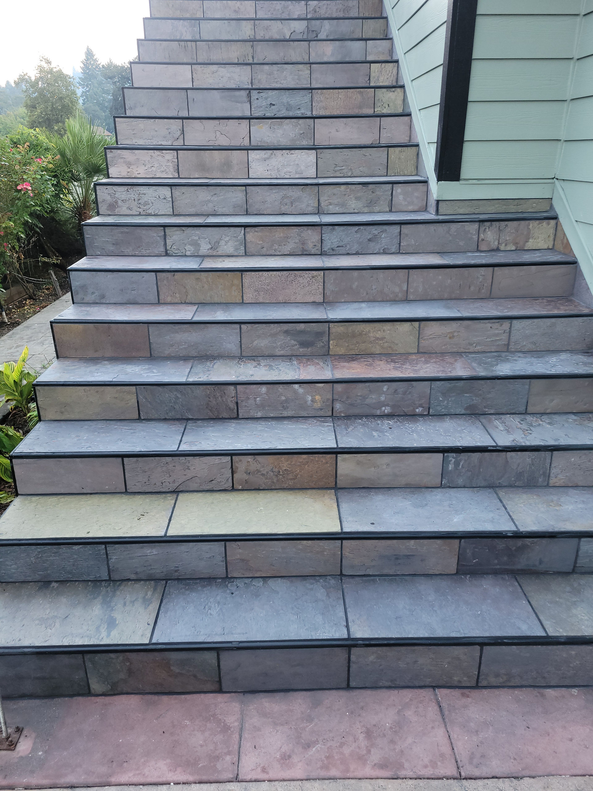 Douglas Biltzen's DB Builders installing durable tiled outdoor steps for a home in Humboldt County, CA