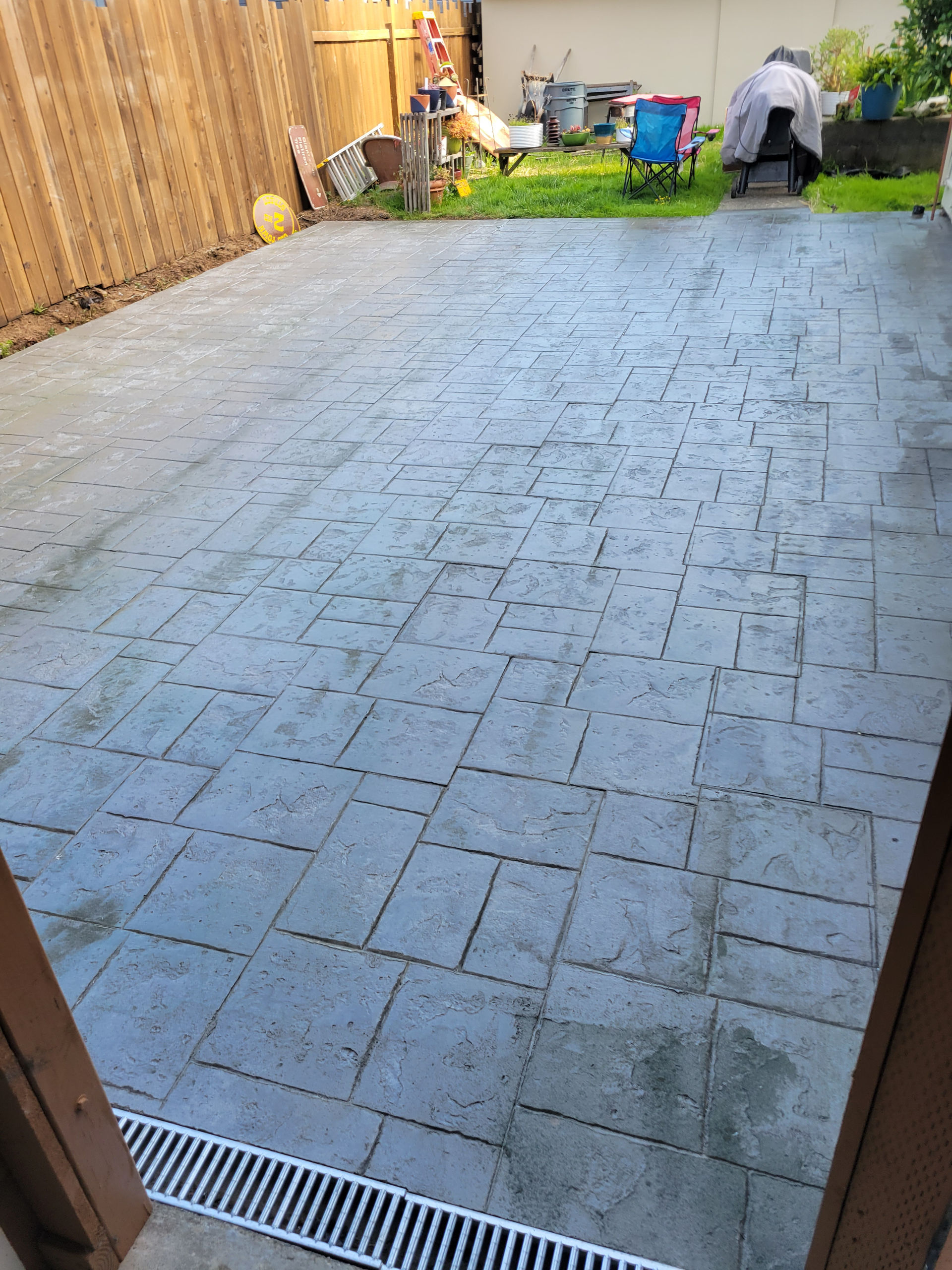 Douglas Biltzen's DB Builders stamped concrete patio with linear drainage system in Humboldt County, CA