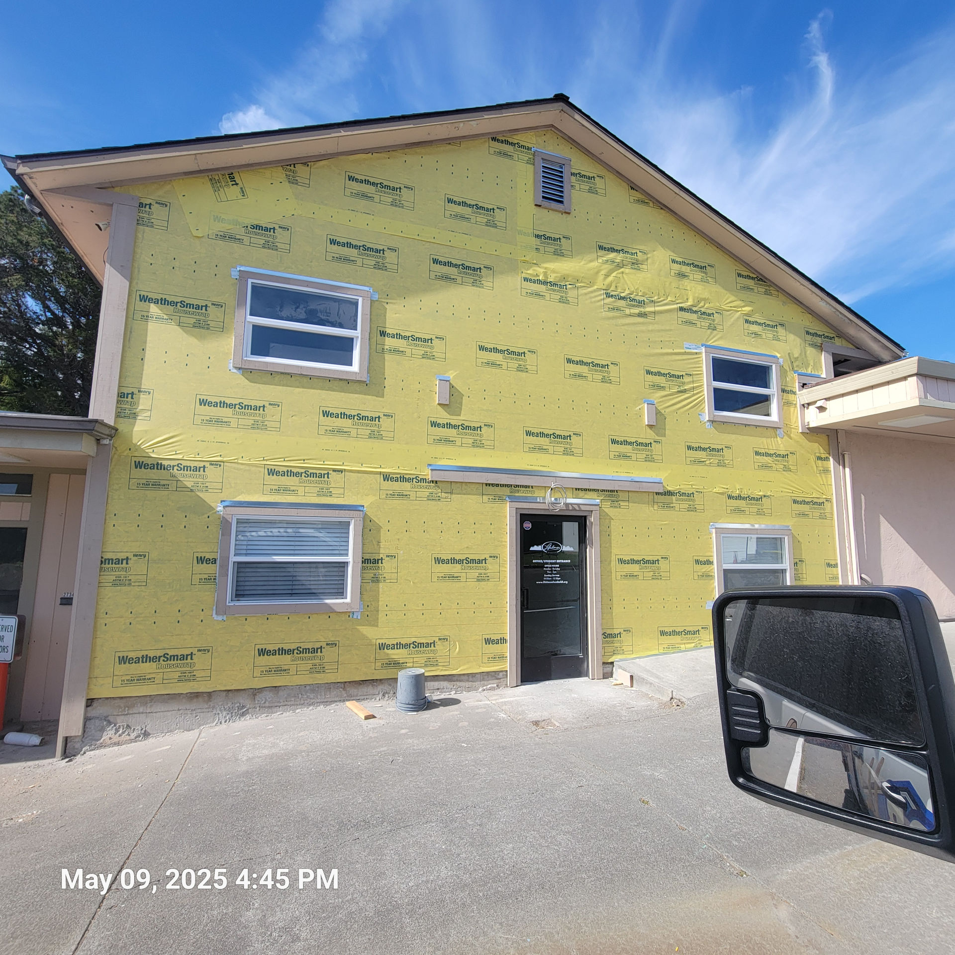Douglas Biltzen's DB Builders installing house wrap and new windows for a home exterior in Humboldt County, CA