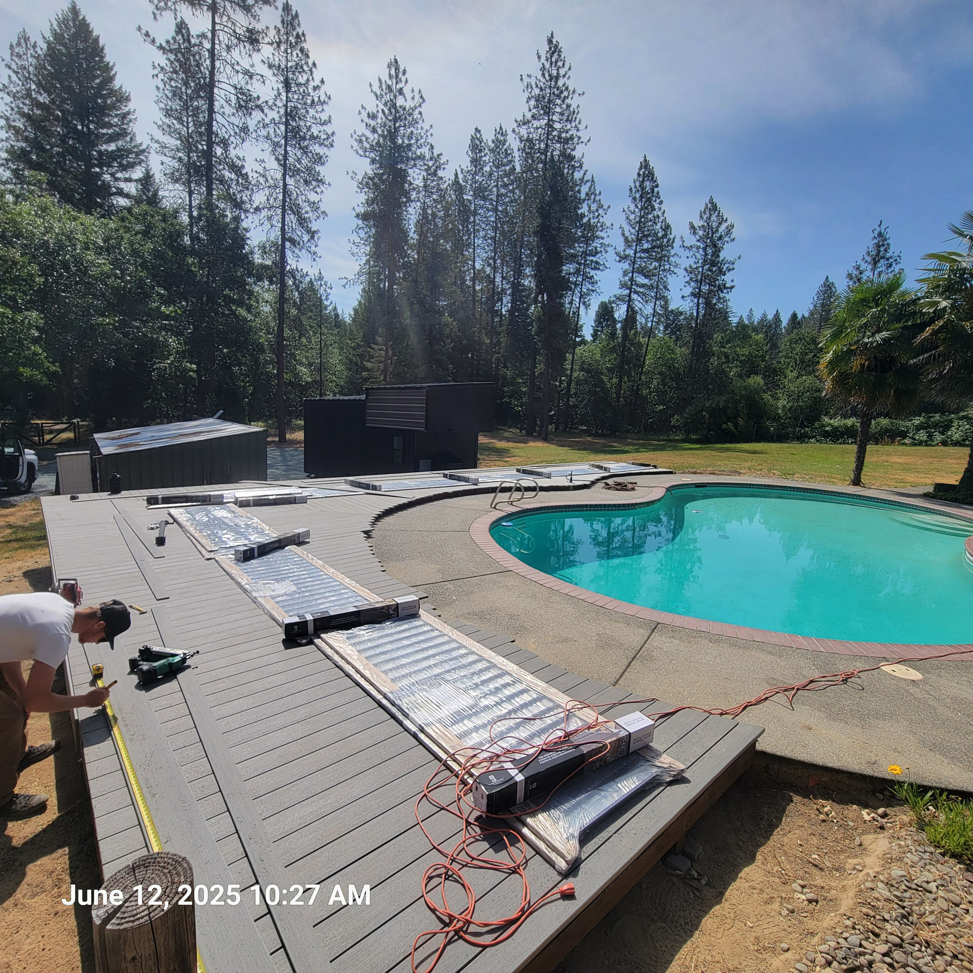 Douglas Biltzen's DB Builders installing solar pool heating panels on a custom deck in Humboldt County, CA